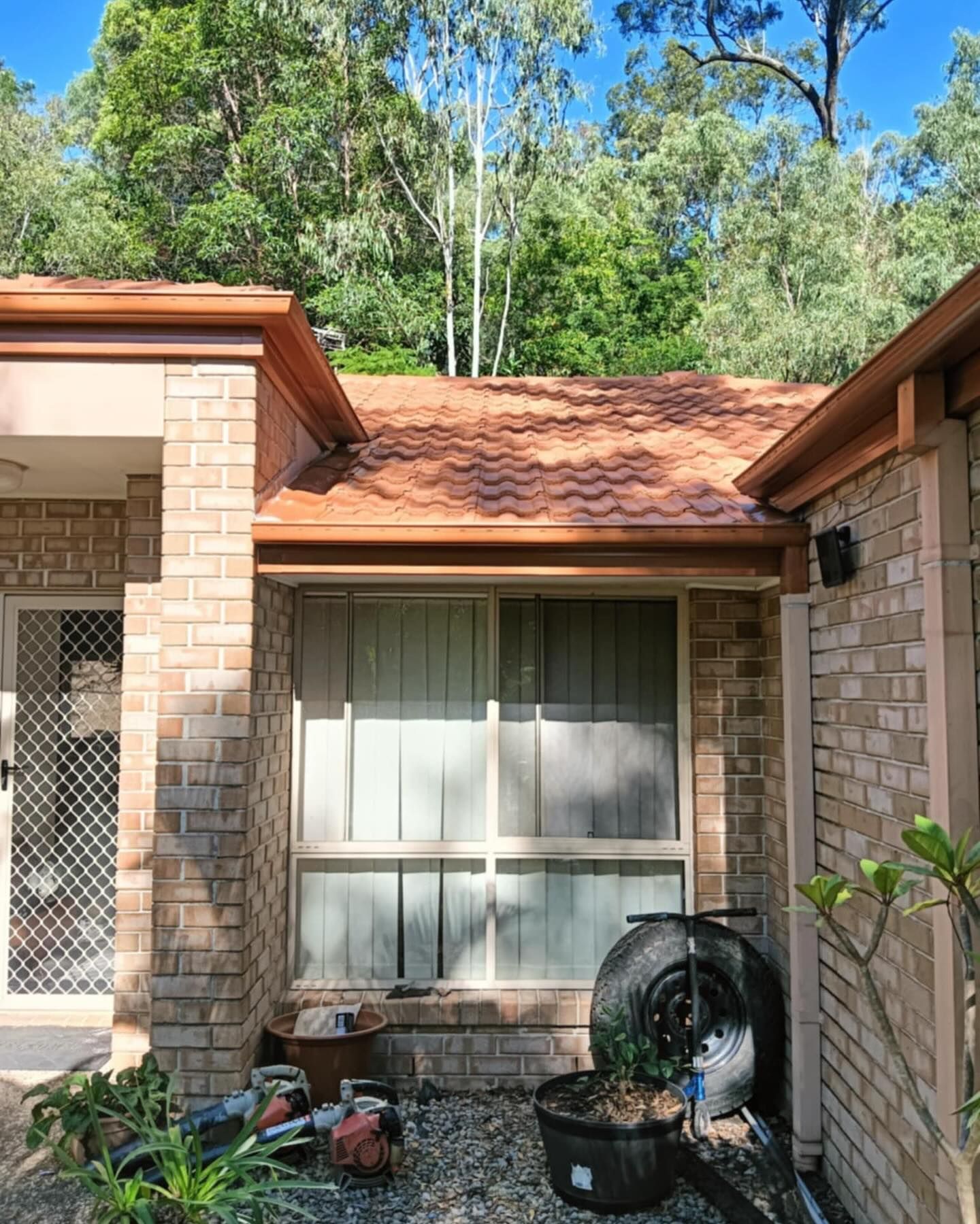 A House With A New Roof And Gutter — Magic Wand Roof Restoration & Painting in Mermaid Beach, QLD