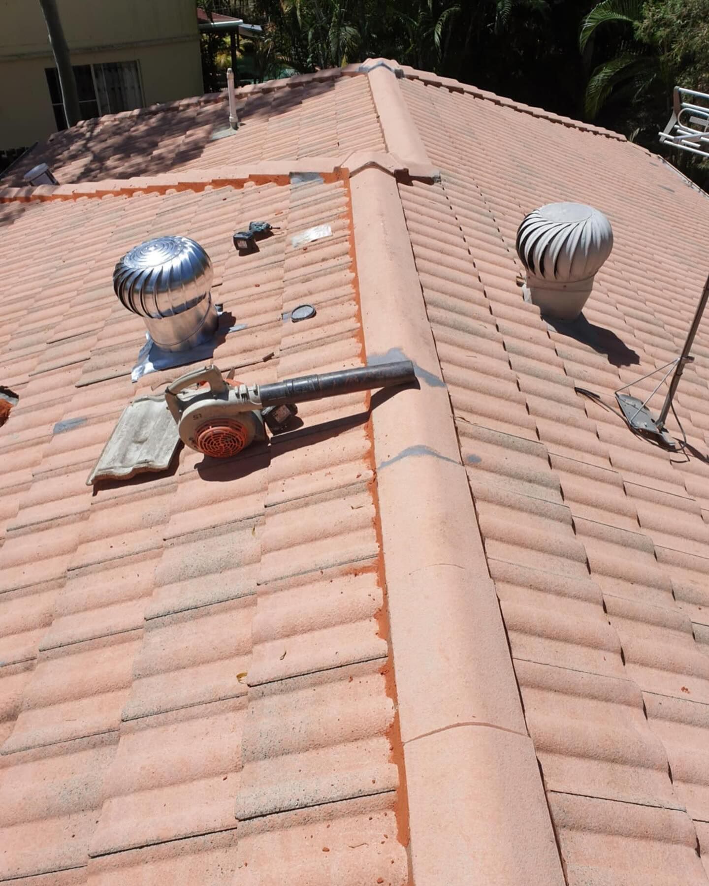 A Roof Is Being Worked On To Repair It — Magic Wand Roof Restoration & Painting in Tweed, NSW