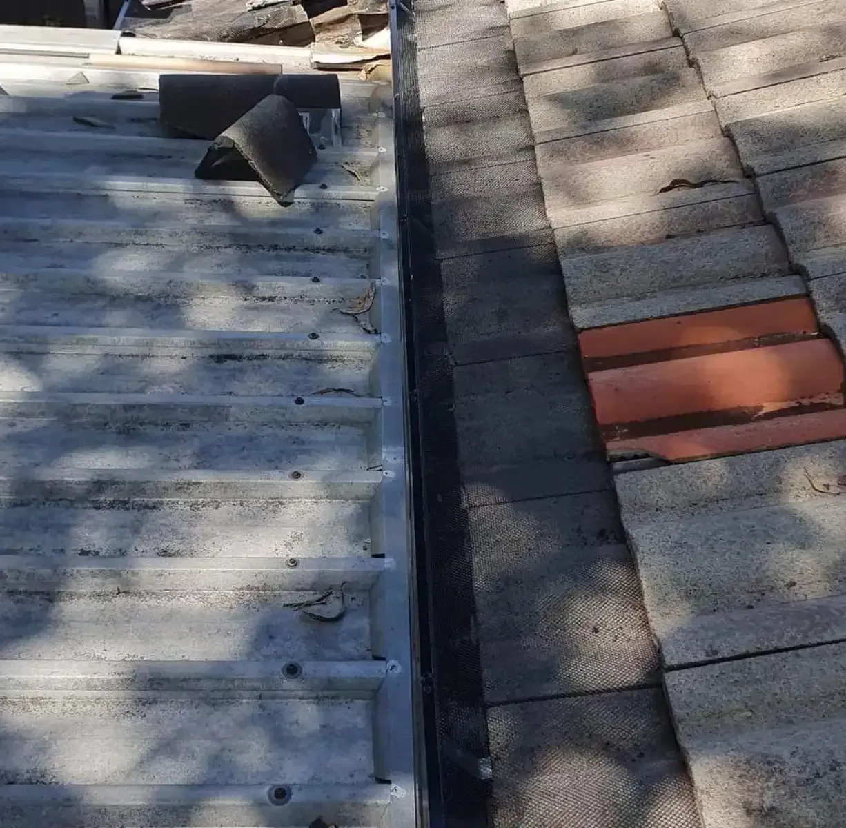 A Roof Is Being Repaired — Magic Wand Roof Restoration & Painting in Mermaid Beach, QLD