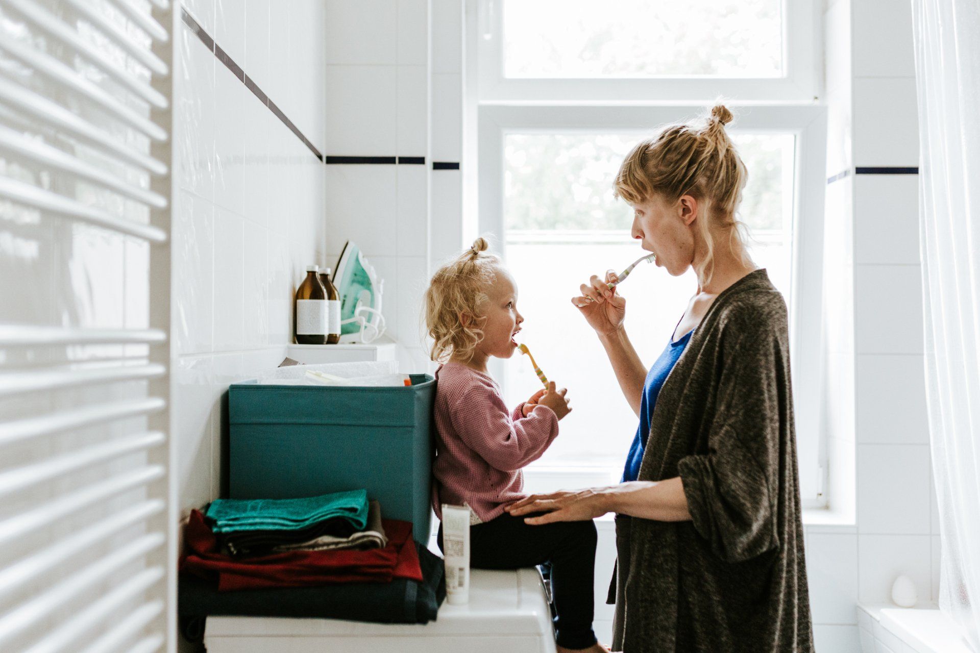 Young mother with a child brushing teeth — Madison, WI — East Grove Dental