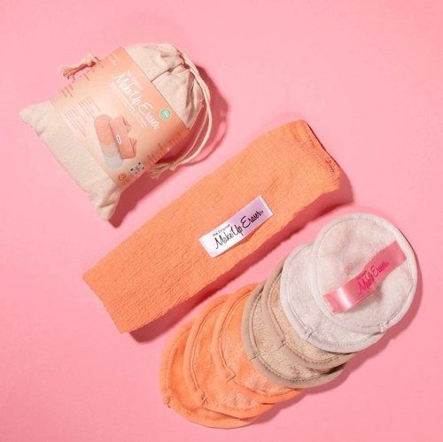 A Bag Of Cotton Pads And A Headband On A Pink Surface — Mackay Skin Clinic In North Mackay, QLD