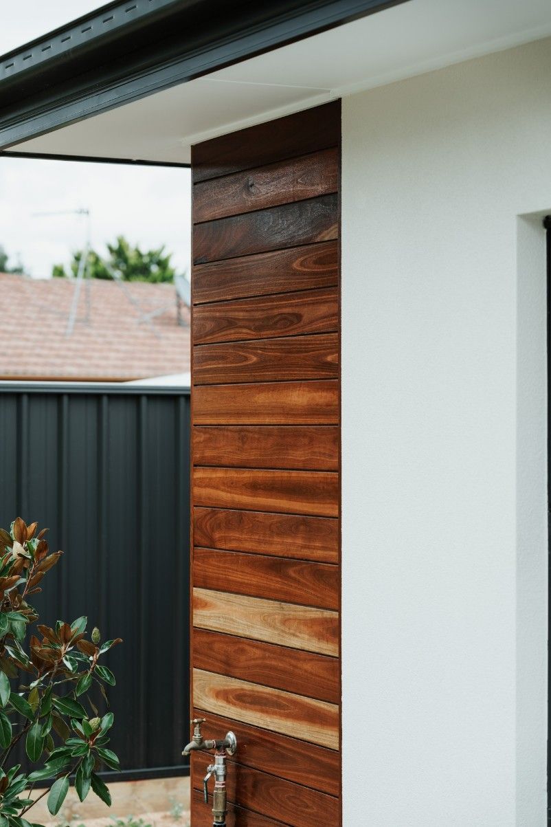 A House With a Wooden Siding and a Black Fence — Imperial Build Co. in Woden, ACT