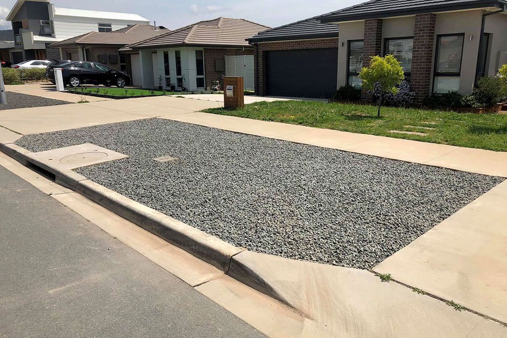 A Gravel Driveway in Front of a House in a Residential Area — Imperial Build Co. in  Coombs, ACT