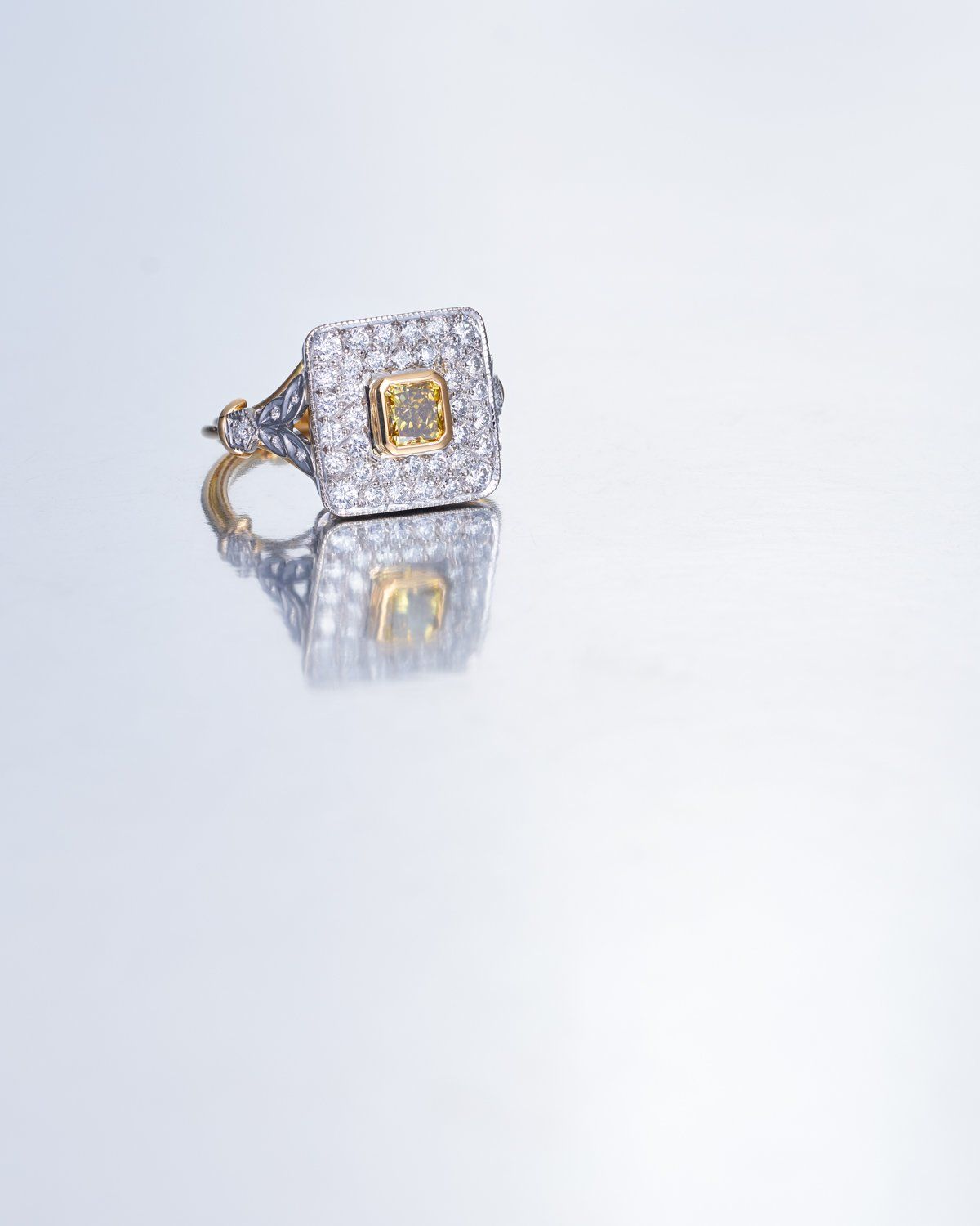 Square diamond ring with yellow stone