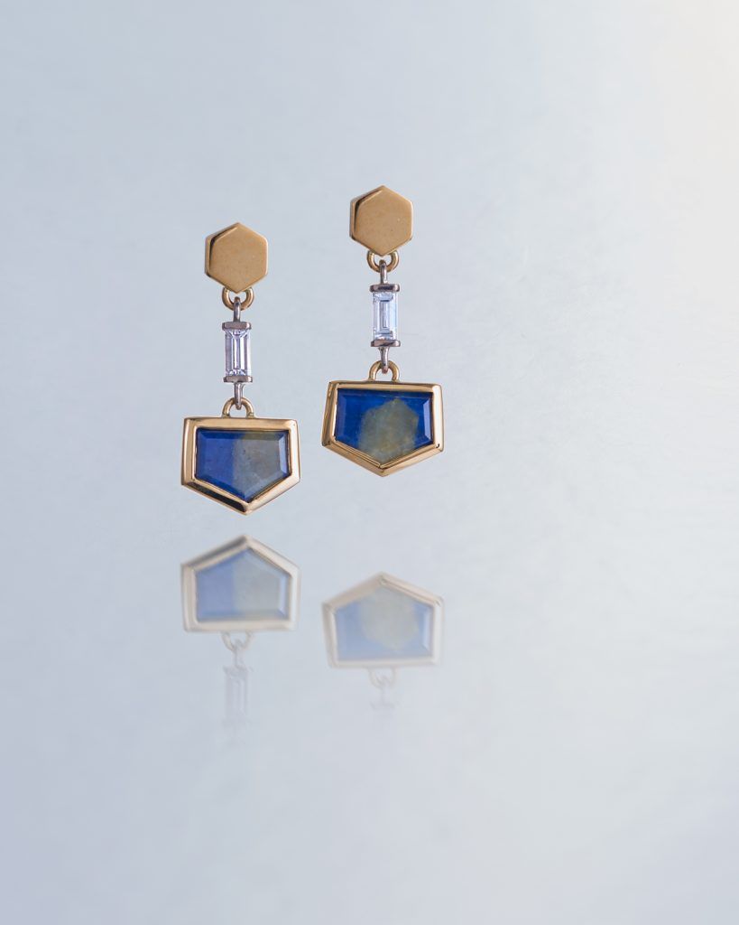 Badge shaped hanging blue earrings