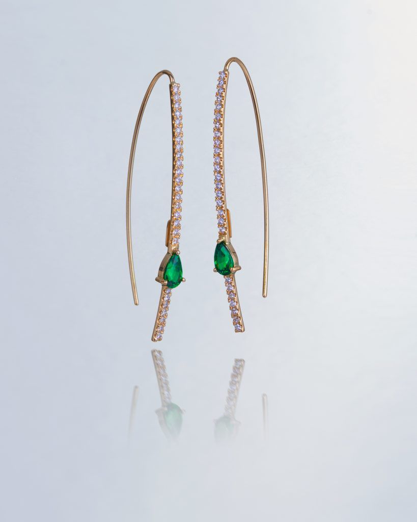Long diamond earrings with green stones