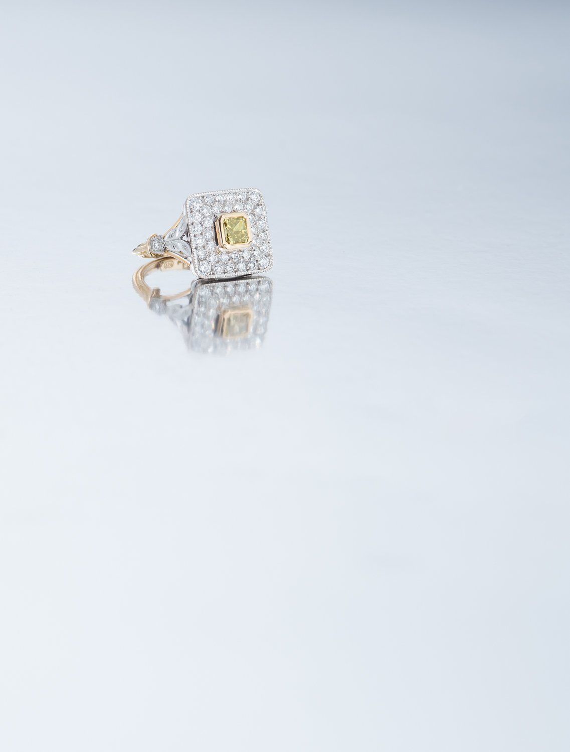 Square gold and diamond ring with yellow stone