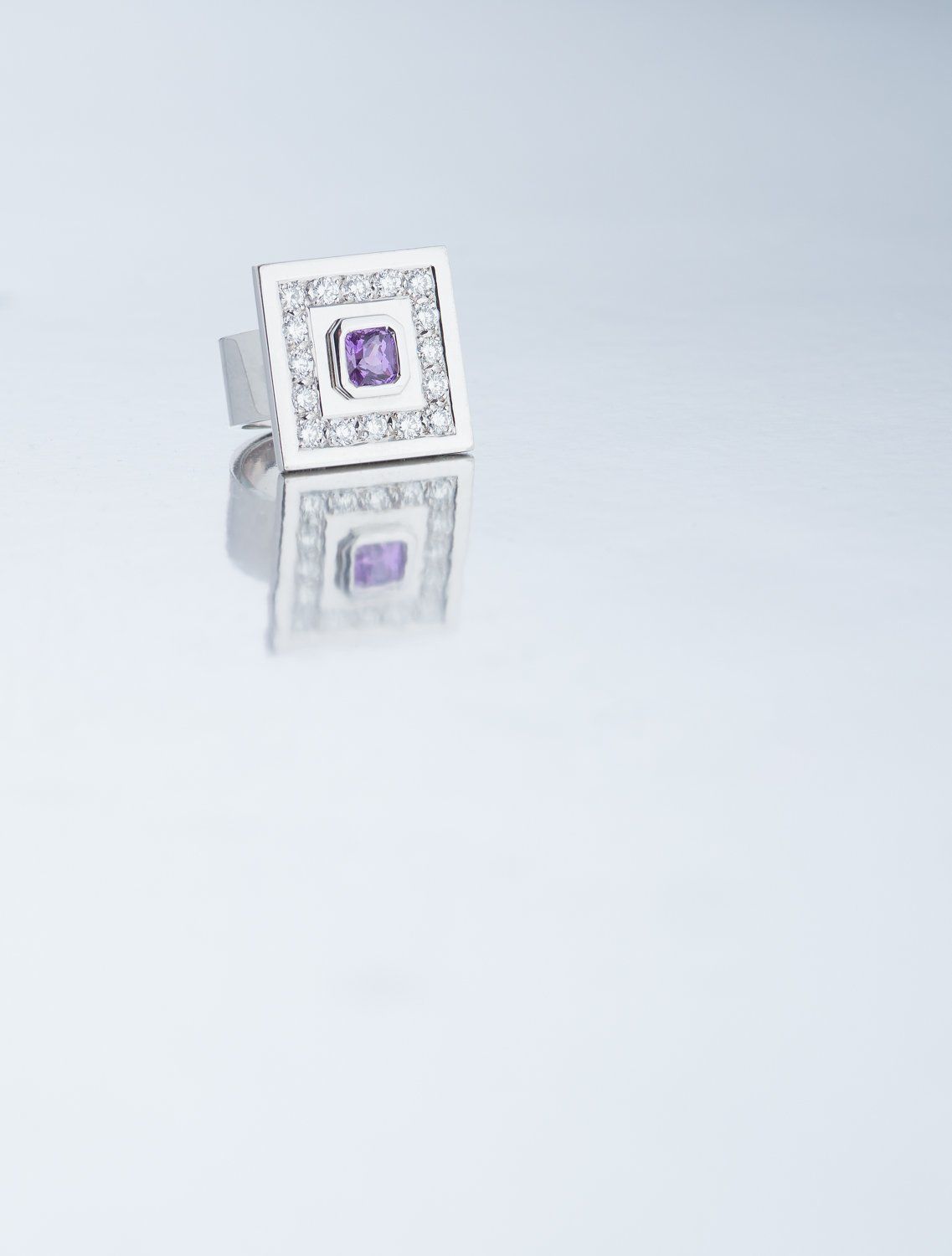 Square silver and diamond ring with purple stone