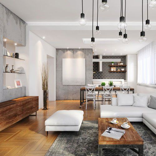 Modern hipster apartment interior. Open space loft, living room with dining room and kitchen in the back. Large white sofa, vintage decorative carpet, coffee table with coffee, seat, dining table with armchairs. Large pendant light. large windows with sunlight, green plant wall. lots of decoration. TV set. interior design copy space. Concrete wall, wooden parquet floor. sunlight render.