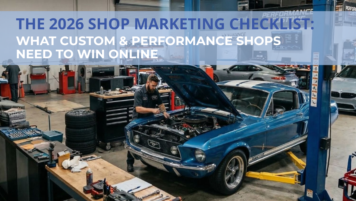 Automotive technician working on a classic blue Ford Mustang inside a professional performance shop 