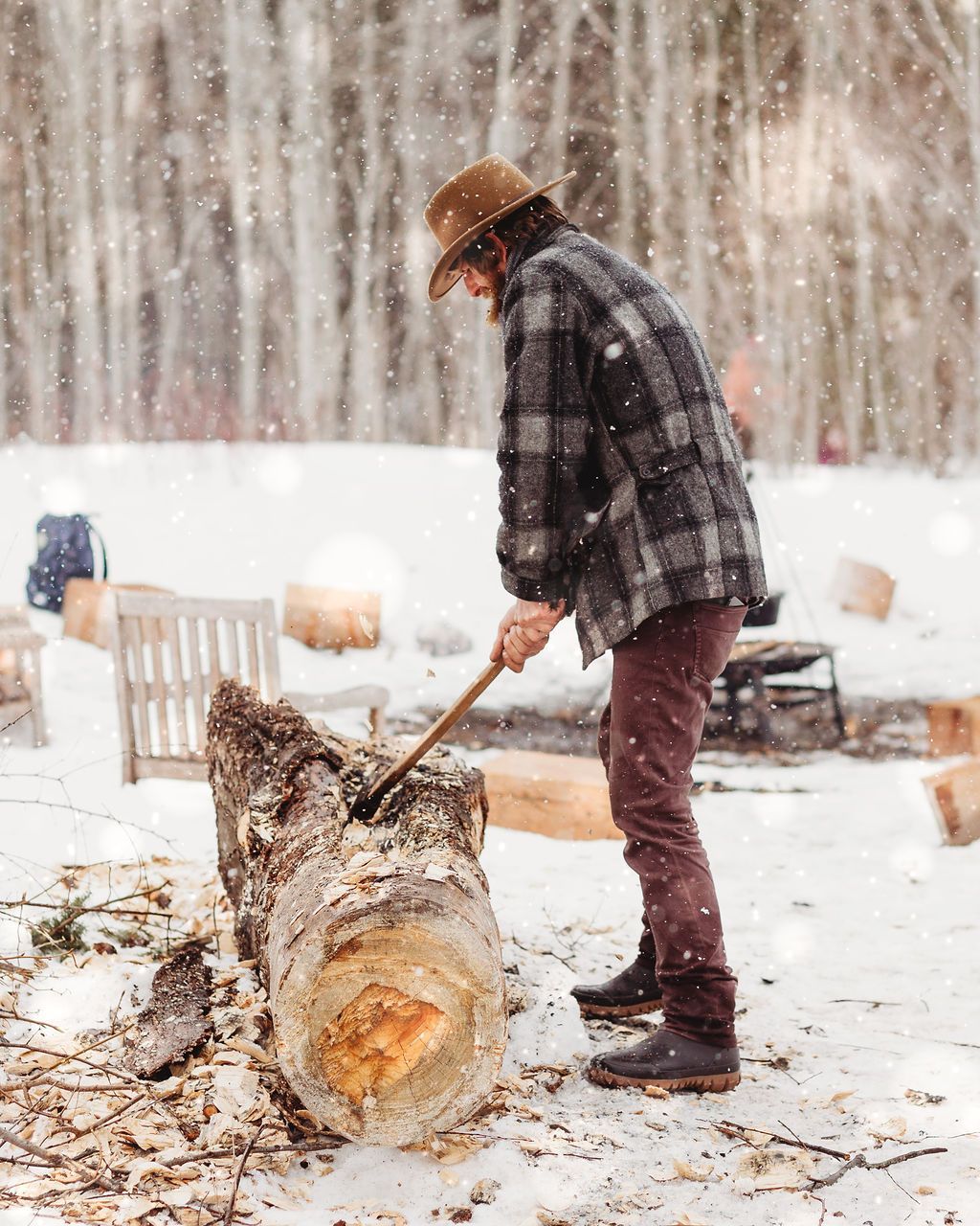 A group of people are sitting around a fire pit.