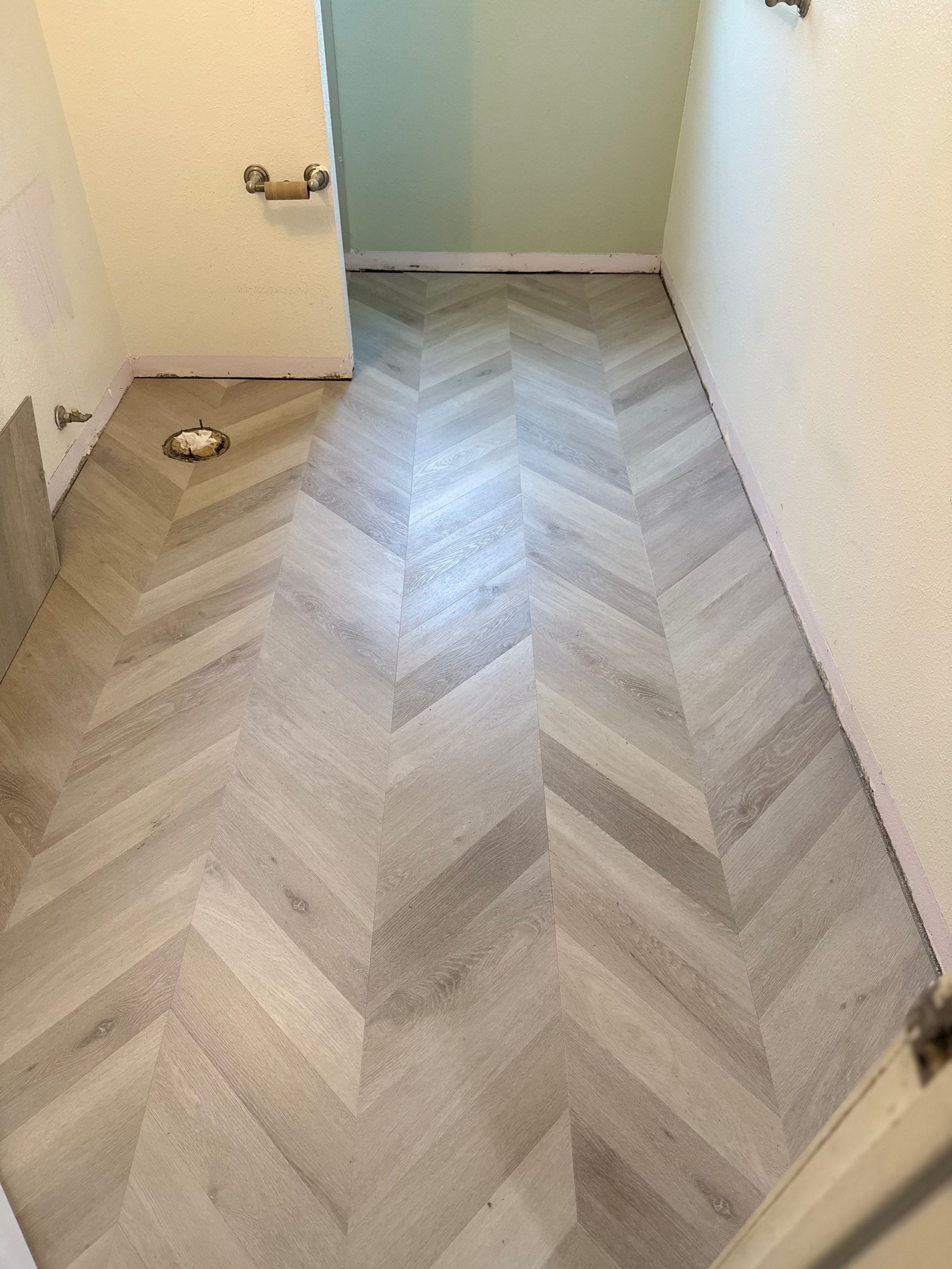 An Empty Basement With Hardwood Floors
