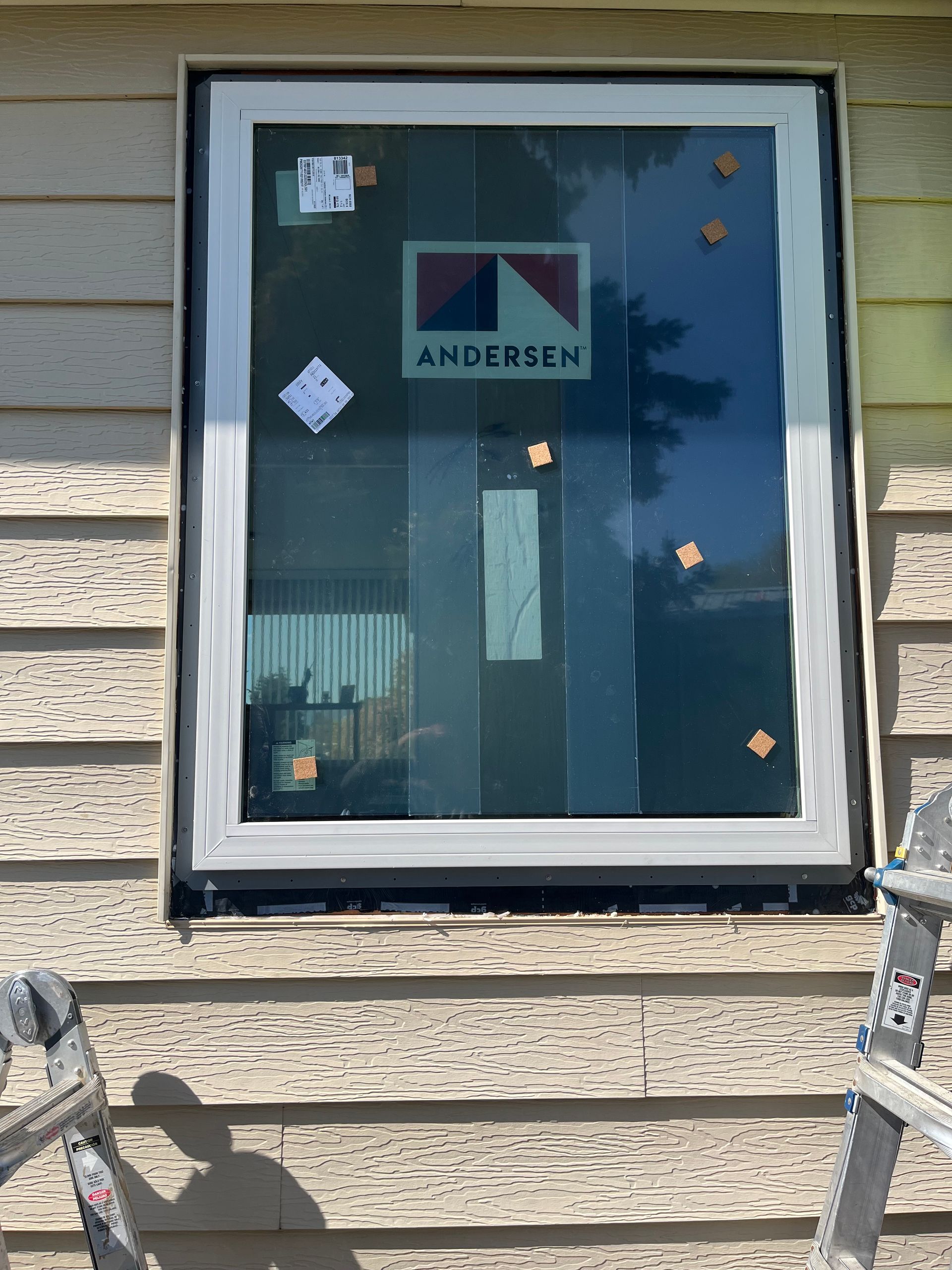 A Window is Being Installed on the Side of a House