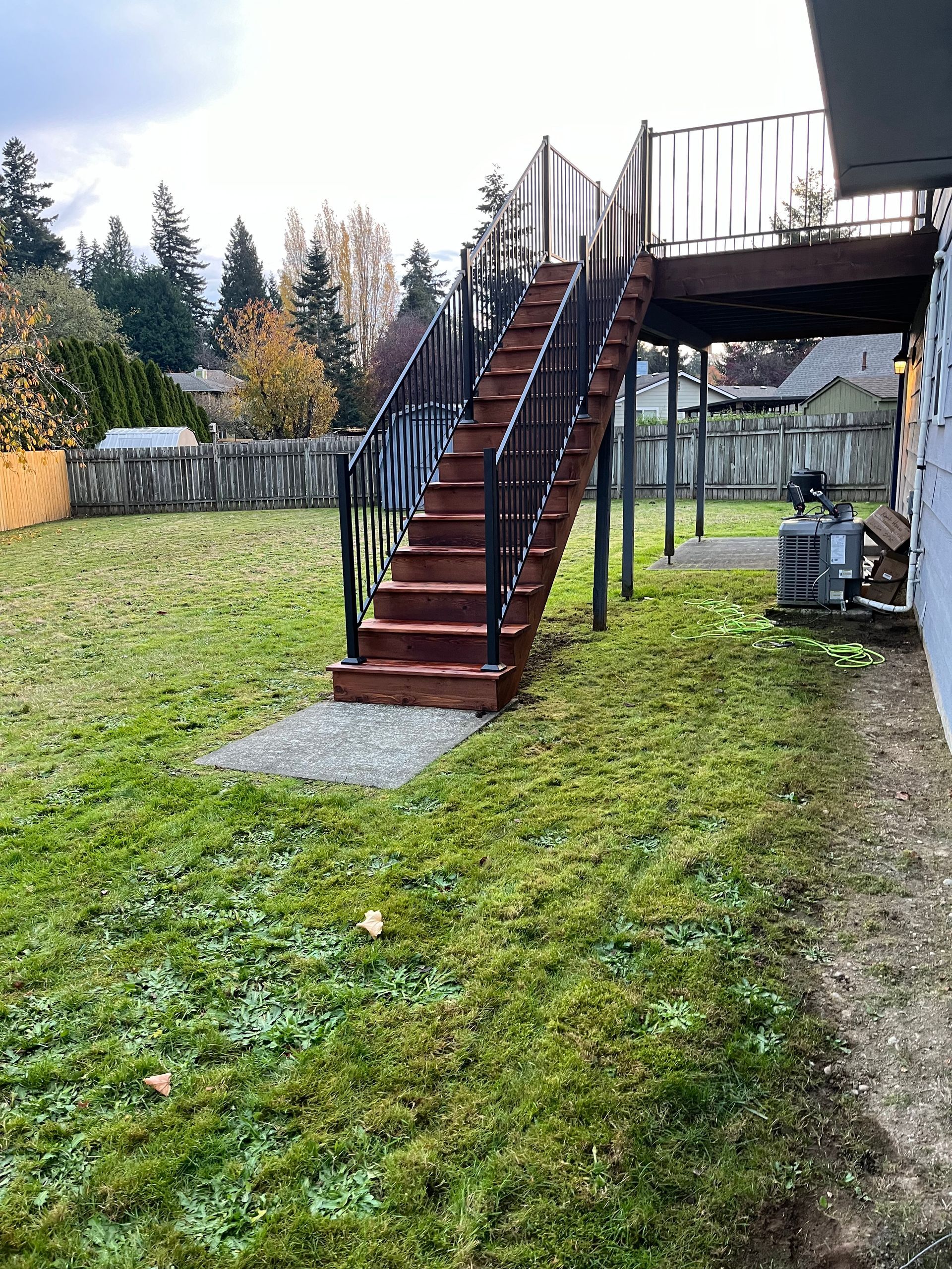 Stairs Leading Up to a Deck in the Backyard