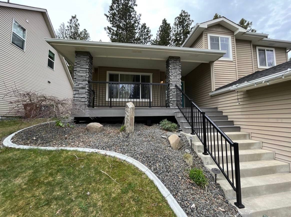Front of a House With Stairs Leading Up to It