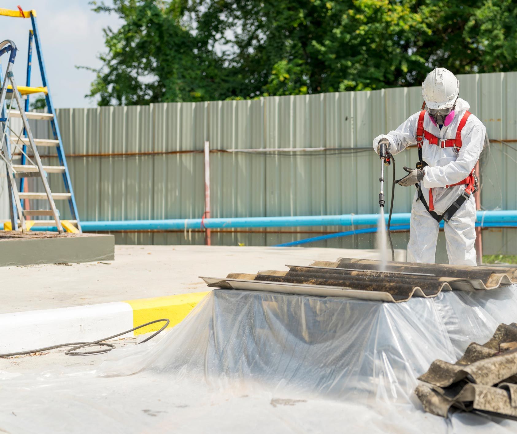 Worker working with the asbestos roof tiles | Rye, VIC | Reg Chadwick Demolitions