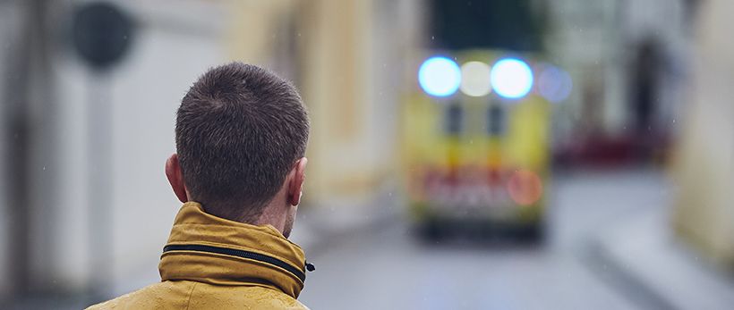 first responder looking at an ambulance in the distance