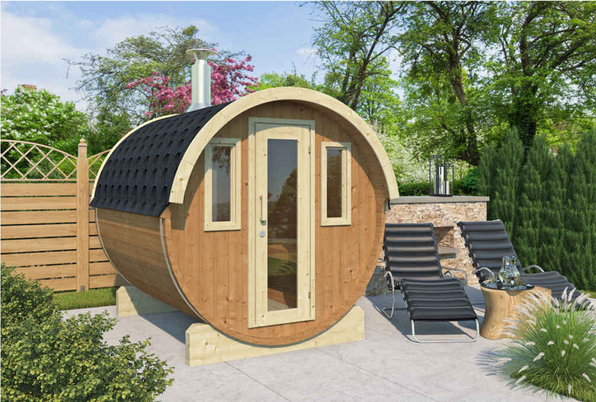 A wooden barrel is sitting on a patio in a garden.