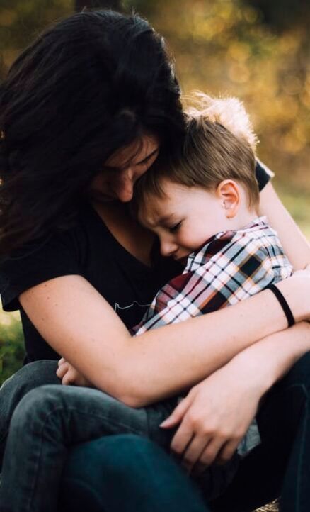 woman hugging a child - counselling