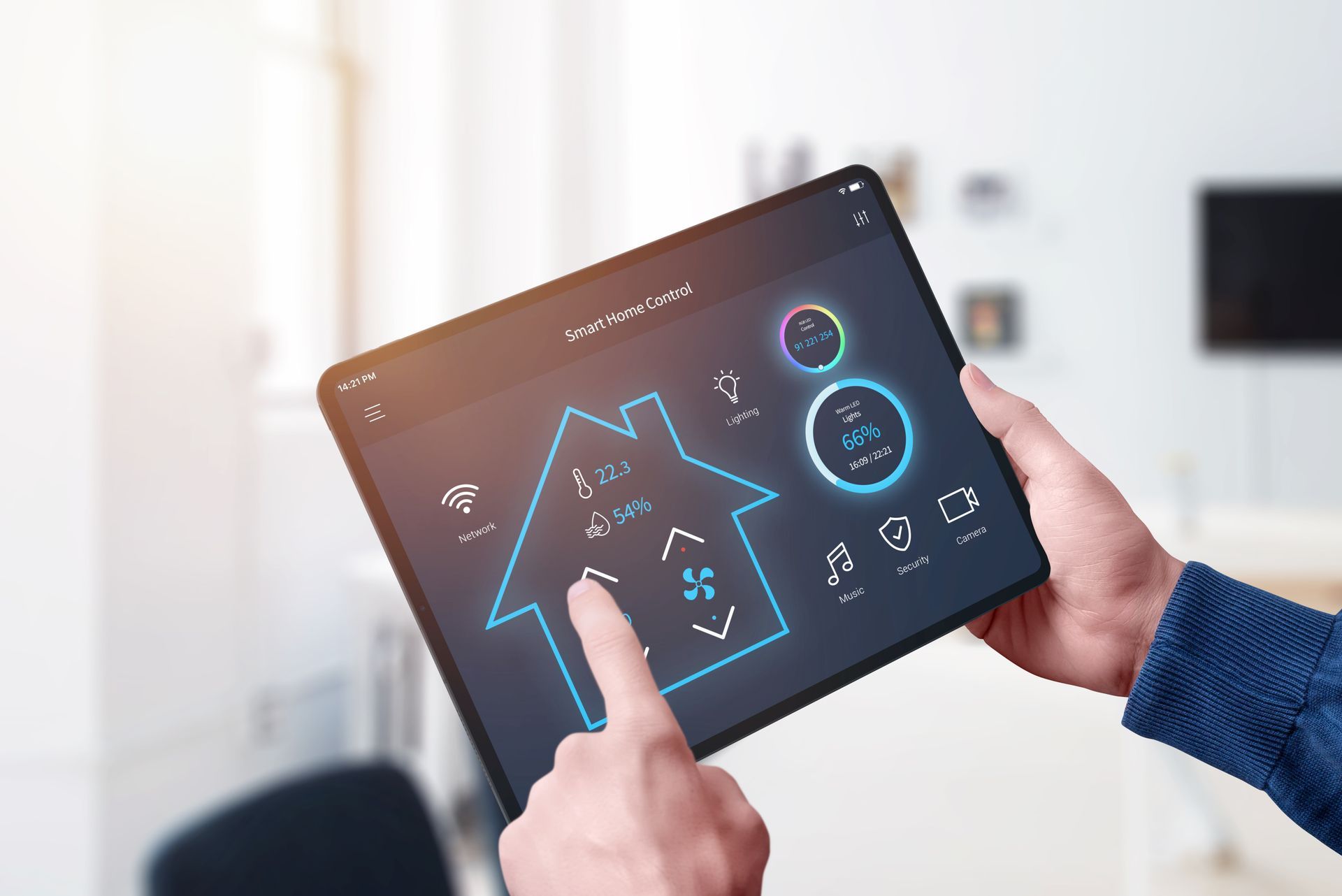Hands using a tablet to control smart home settings. Hands using a tablet to control smart home settings.