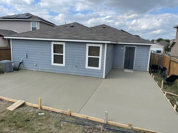 Custom concrete patio installation in Addison, TX featuring durable finish and modern outdoor design.