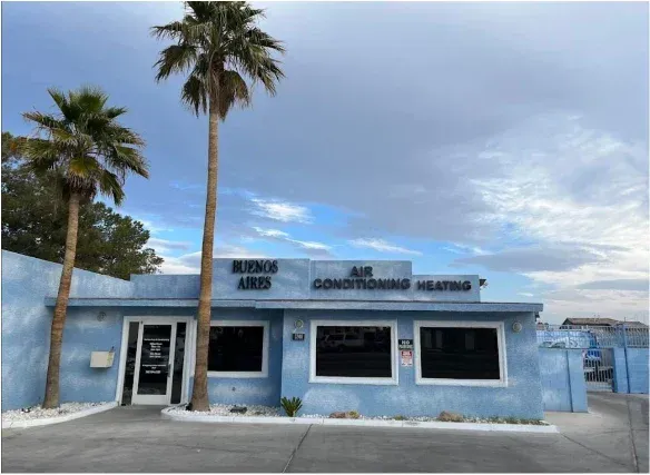 Blue building with palm trees; 