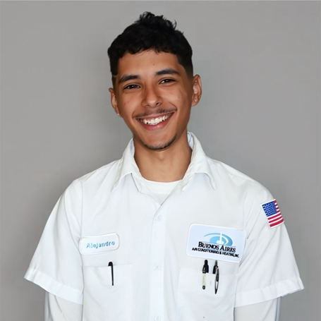 Man smiling in a white work shirt; name tag 