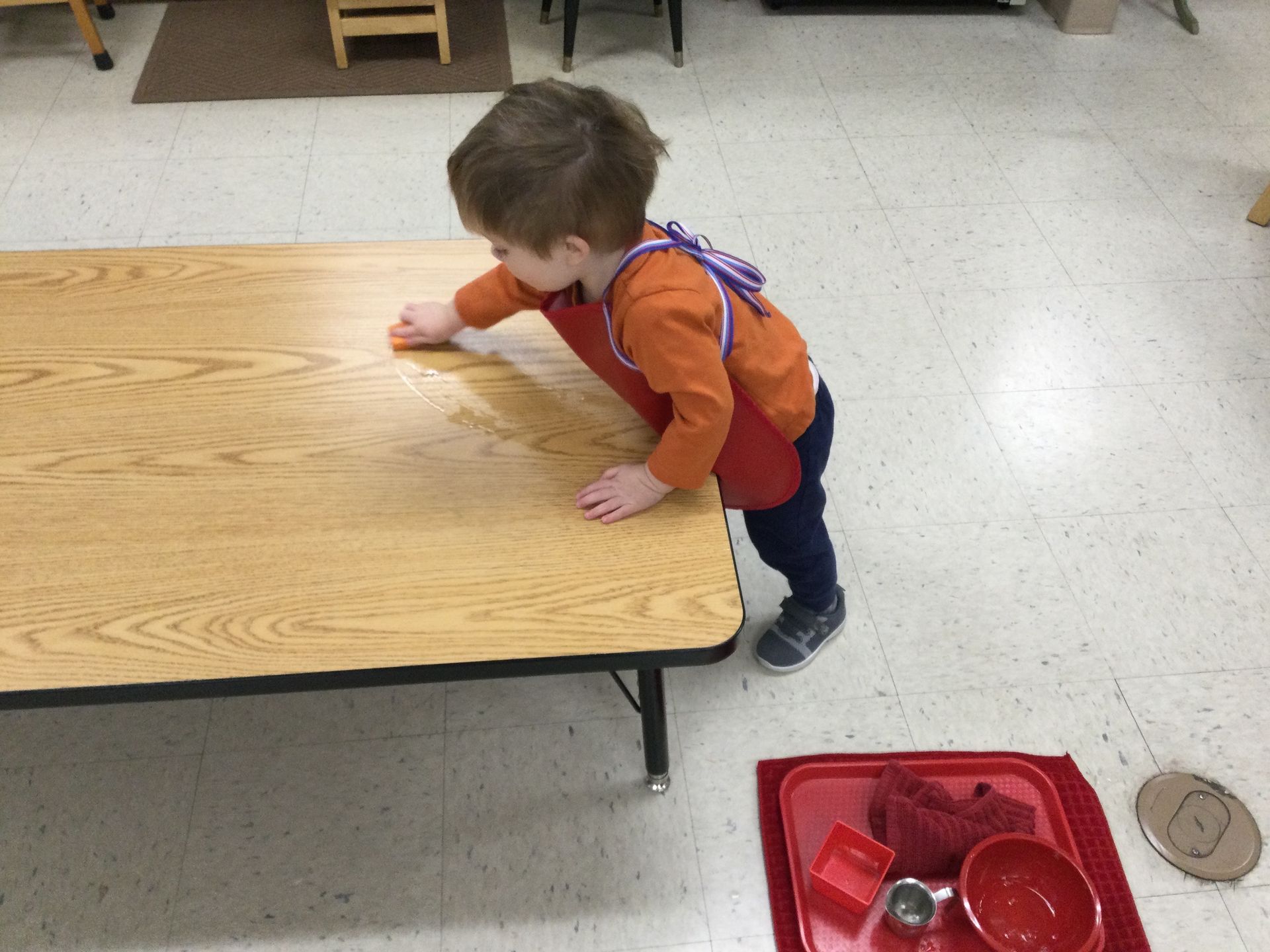 Montessori child working on practical life skills