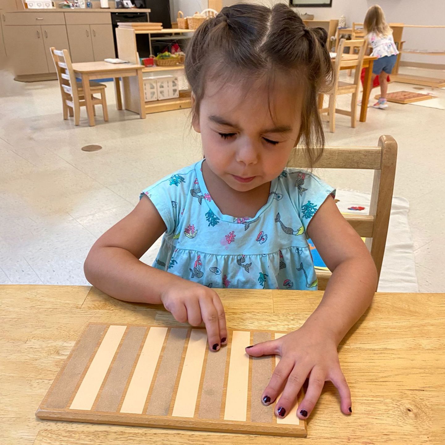 Montessori child working in the classroom 