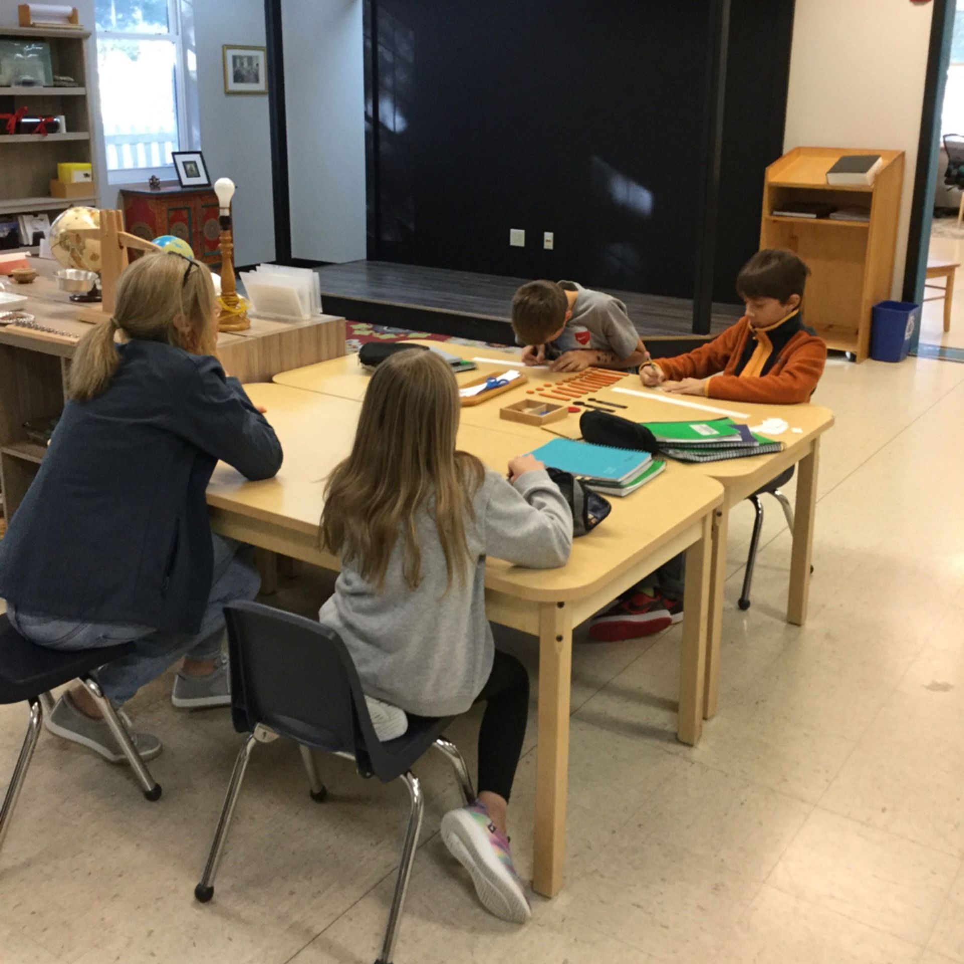 Montessori children working in the classroom 