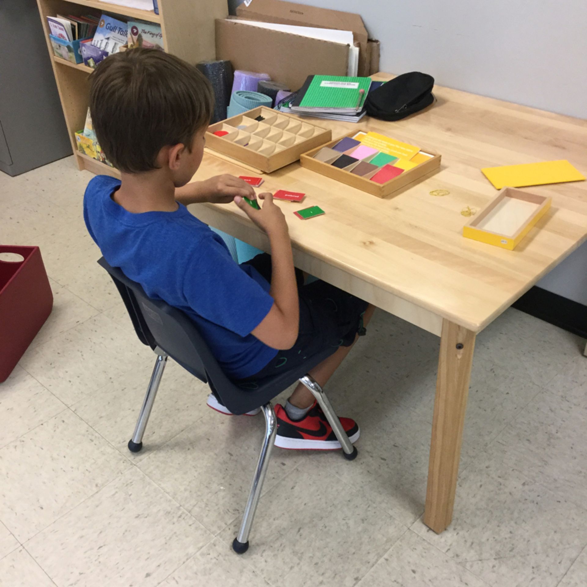 Montessori child working with language materials 