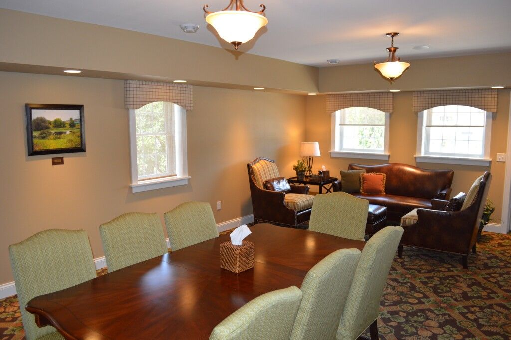A living room with a table and chairs and a couch