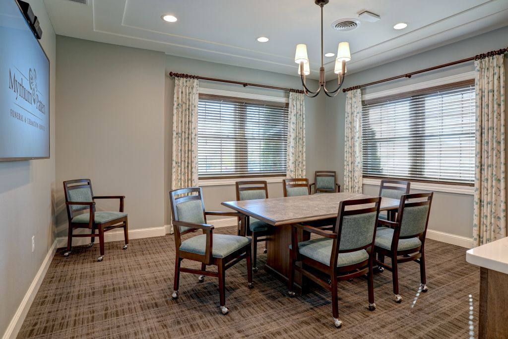 There is a large table and chairs in the room.