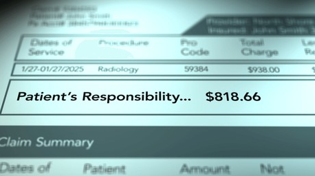 A family is walking down a path holding hands.