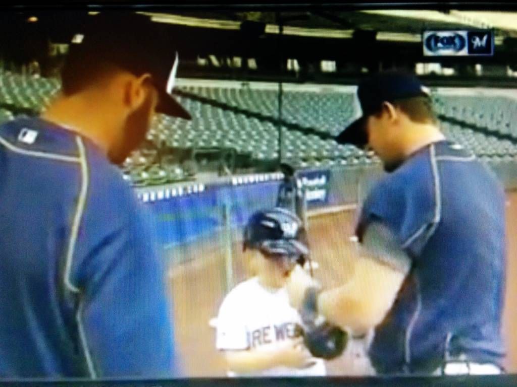 Scooter helps Luka put on batting gloves