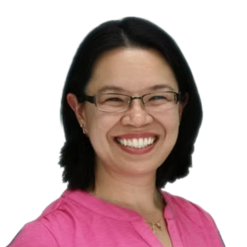 Woman with dark hair and glasses smiles broadly, wearing a pink shirt.
