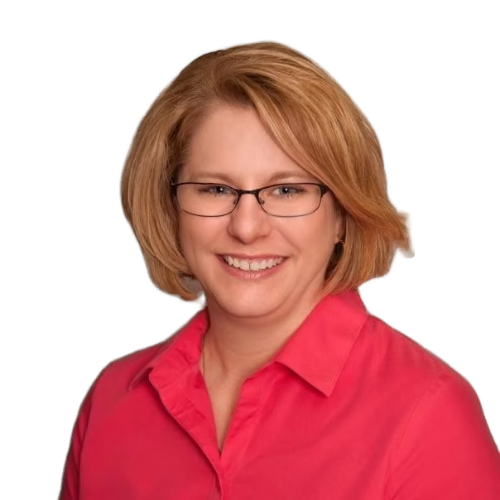 Woman with glasses smiling, wearing a pink shirt, headshot against white background.