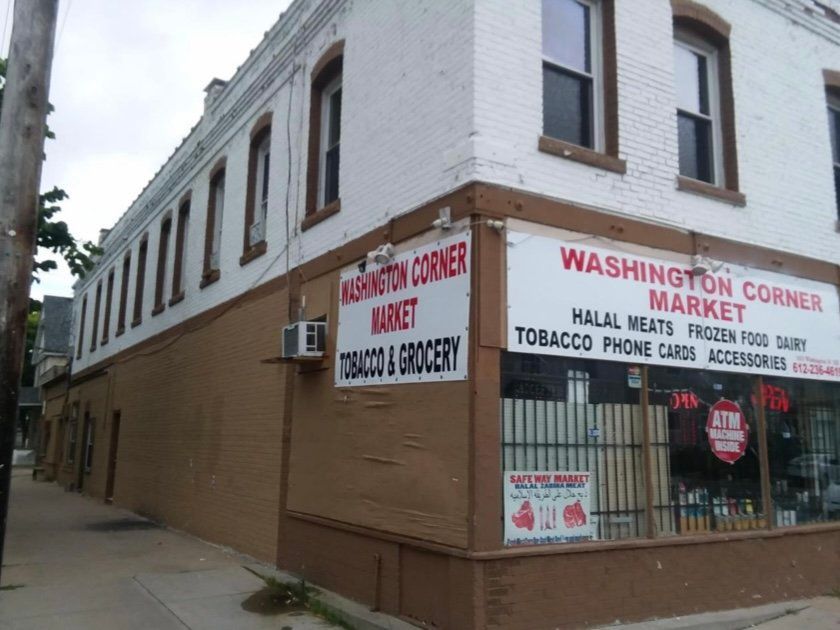 Washington corner market is located on the corner of a building