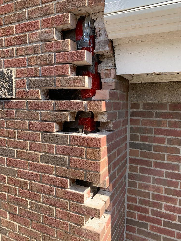 A before and after picture of a brick wall with a window