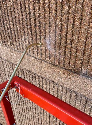 A person is welding a piece of metal with a torch.