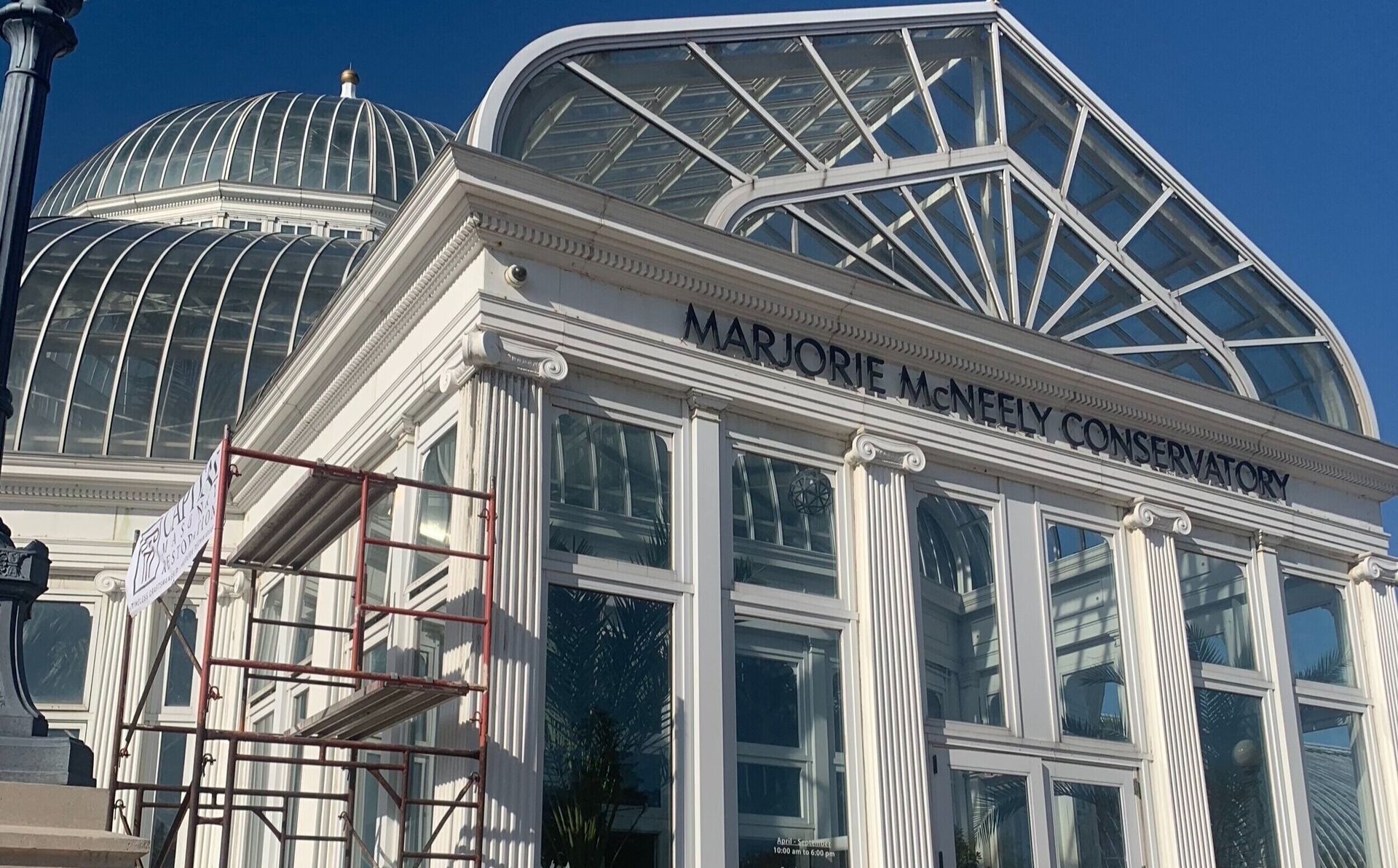 A large white building with a sign that says marionie winery conservatory