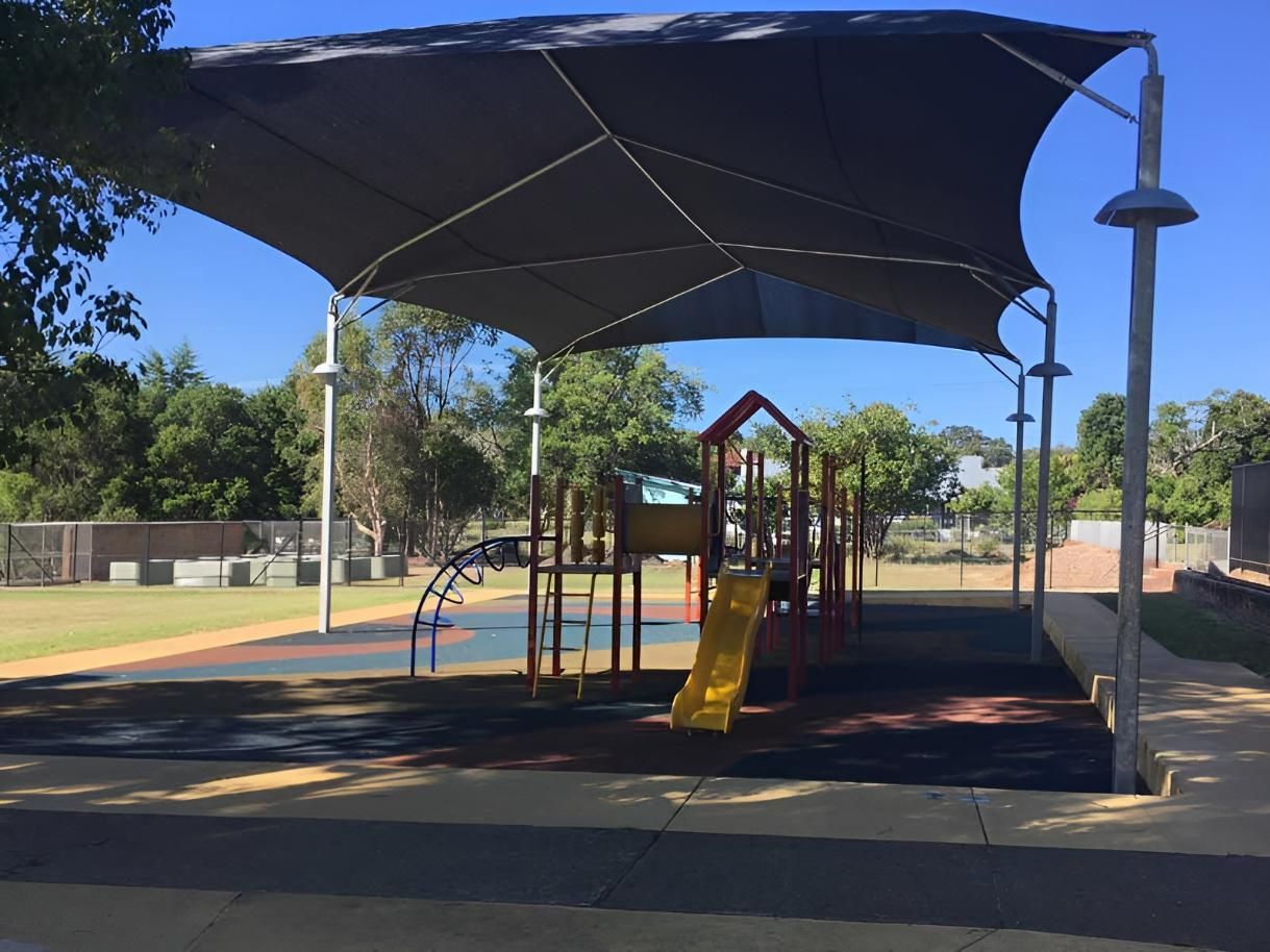A Playground with A Large Umbrella Over It — Jon Wilson Canvas & Shade in Coffs Harbour, NSW
