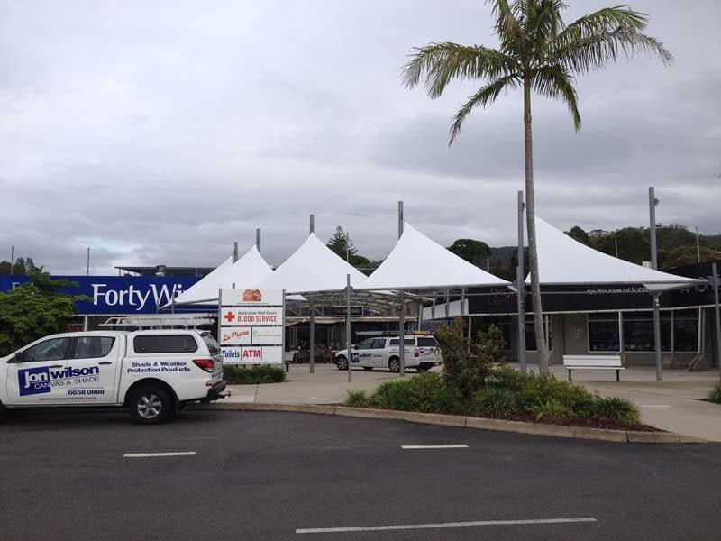 A White Truck Is Parked in Front of A Forty Way Store — Jon Wilson Canvas & Shade in Coffs Harbour, NSW