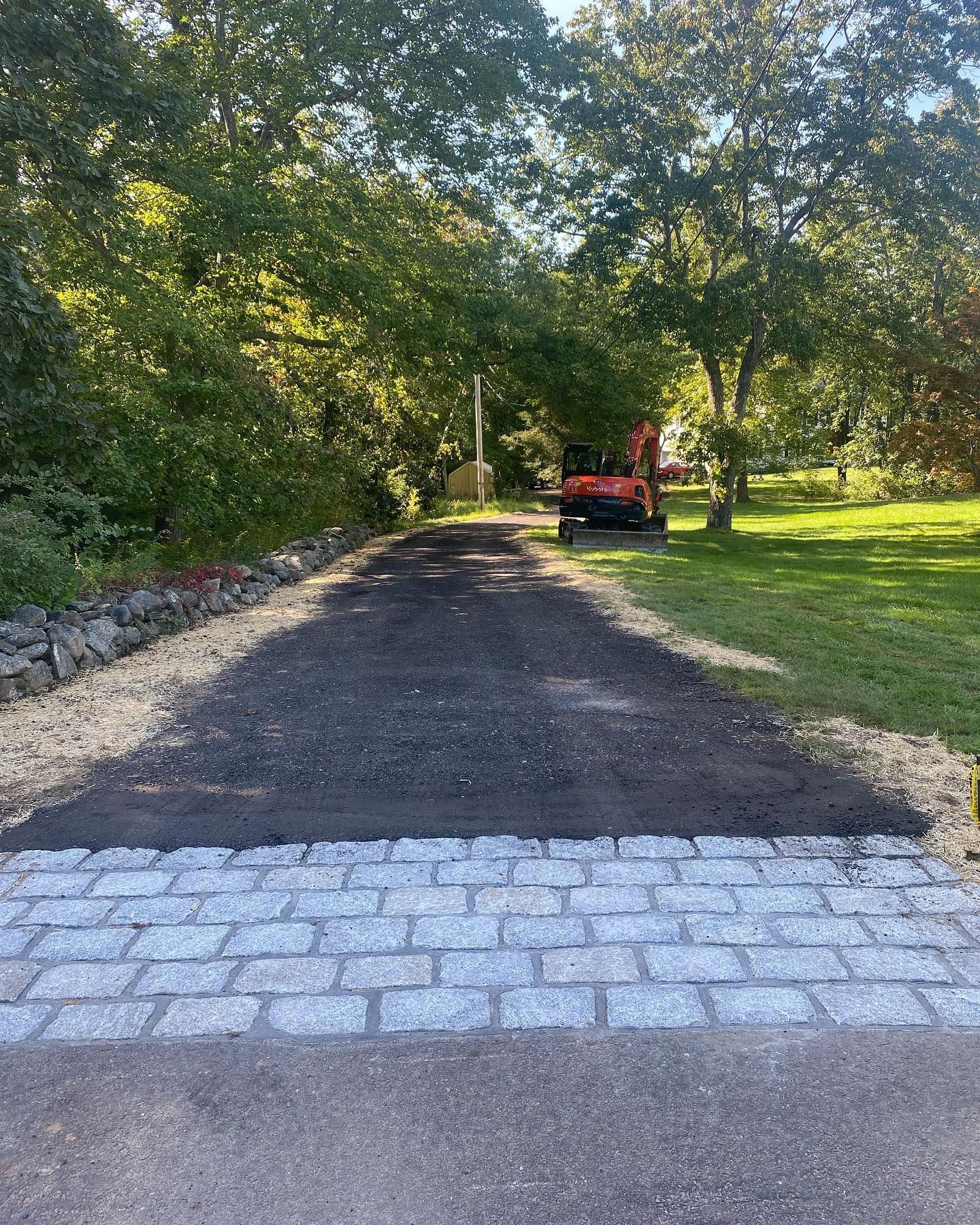 A jeep is parked on the side of a dirt road.