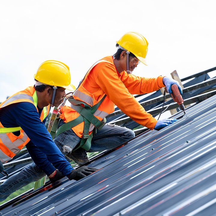 Workers Fixing Roof — Spokane Valley, WA — Garcia Roofing