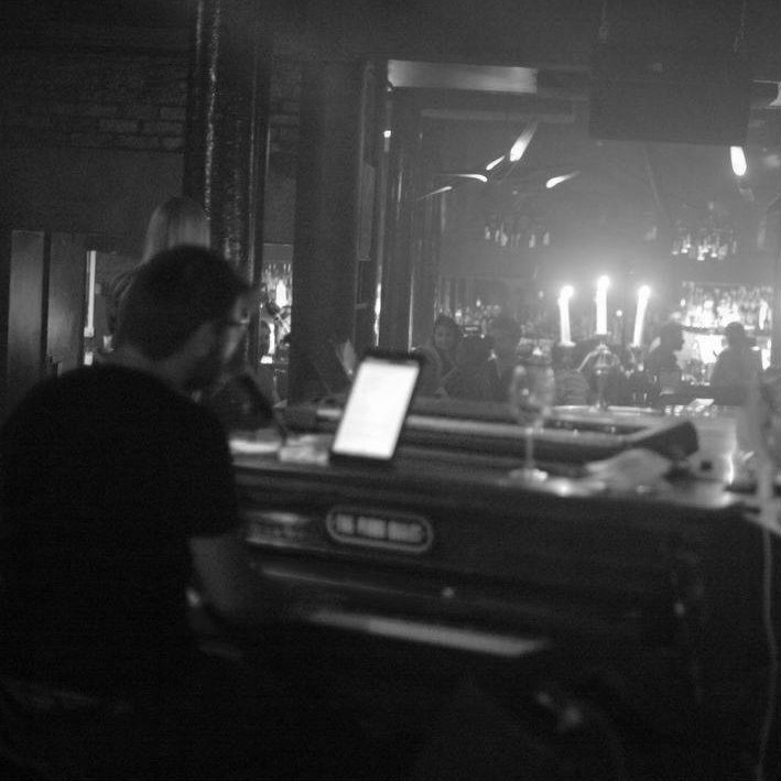 Ollie singing in a venue full of people