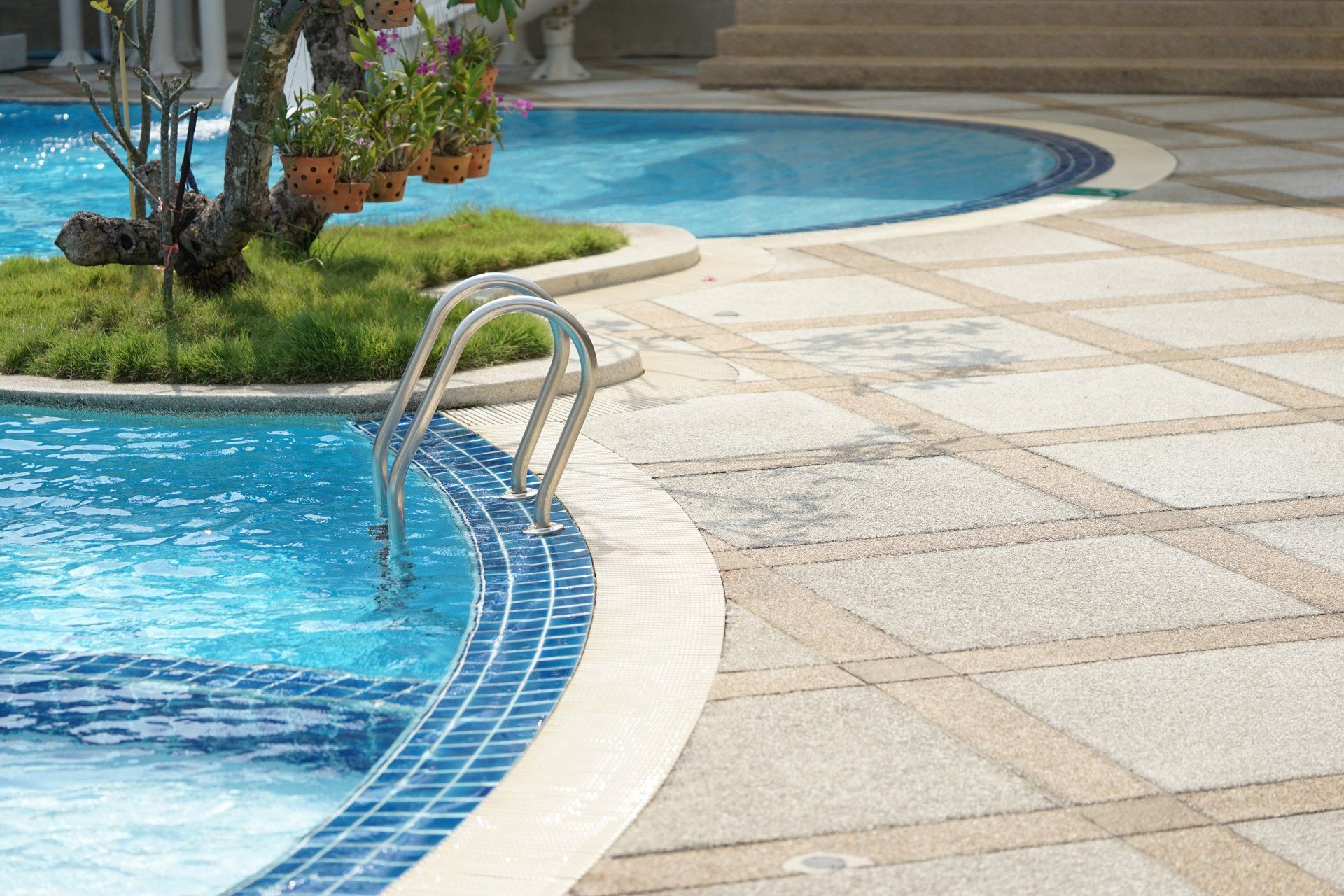 A swimming pool with a staircase leading to it