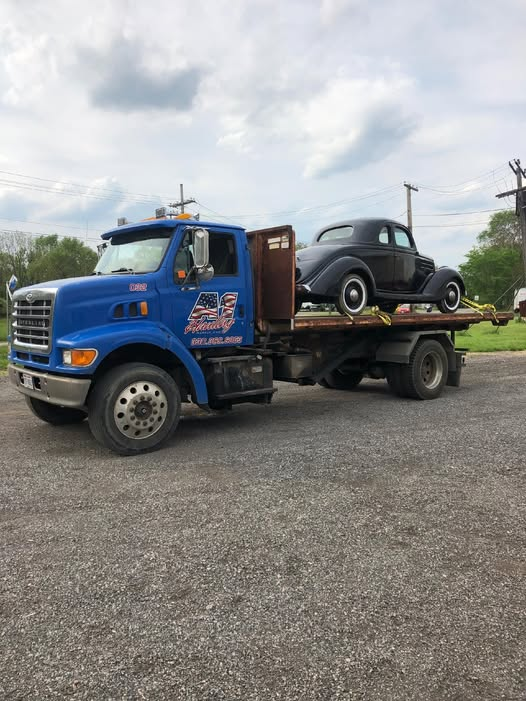 A truck with a forklift on the back of it