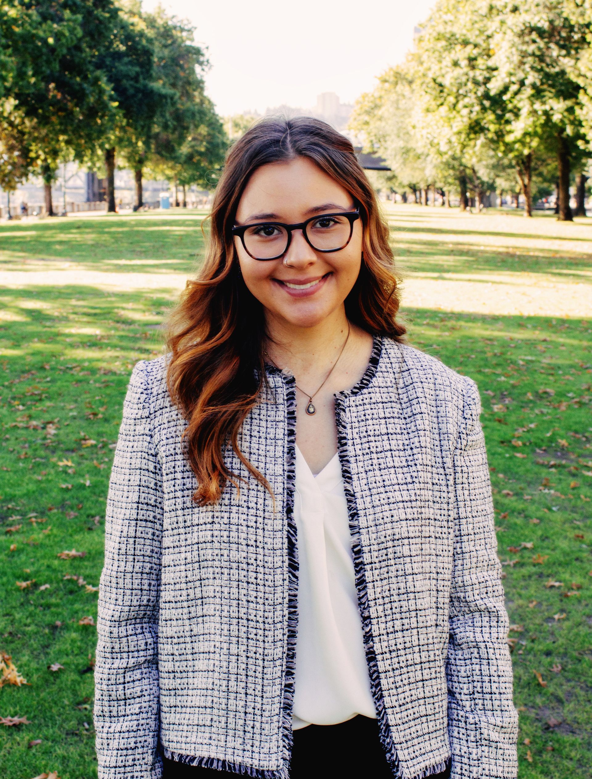 Julianna standing on green grass