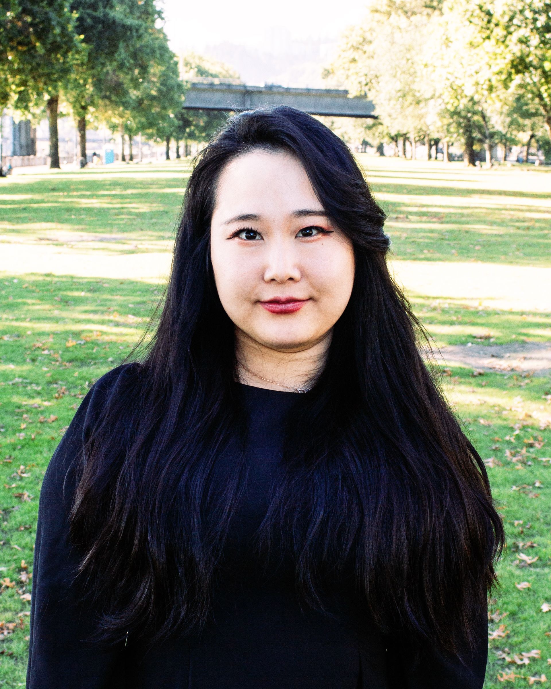 Stella standing on green grass